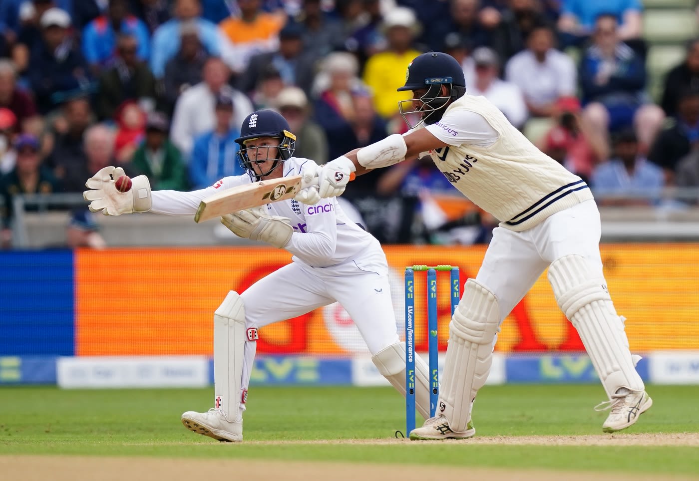 Cheteshwar Pujara reaches out for the ball | ESPNcricinfo.com