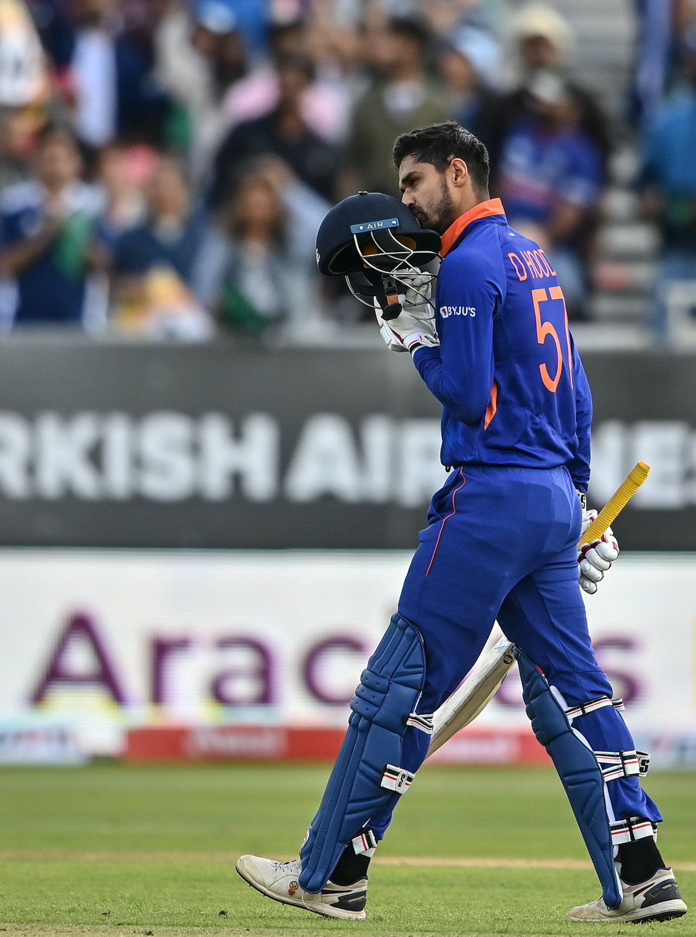 Deepak Hooda kisses his helmet after reaching his maiden T20I century ...