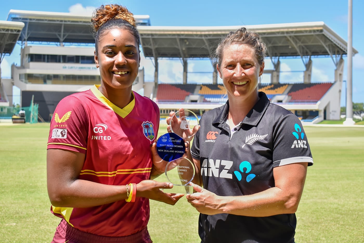 Hayley Matthews and Sophie Devine pose with the ODI trophy ...