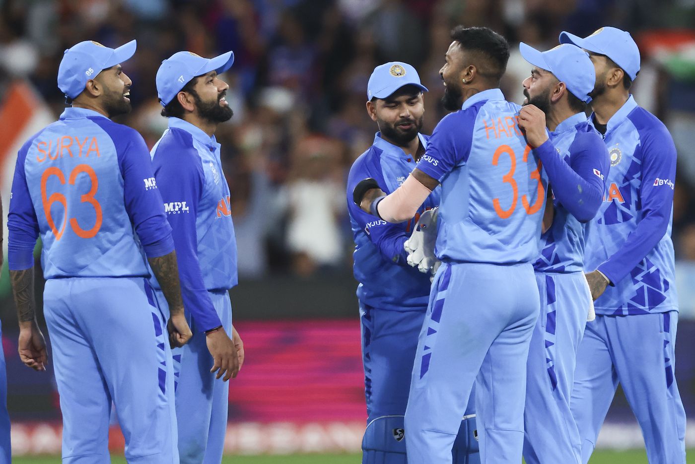 Hardik Pandya is congratulated by team-mates after taking a wicket ...