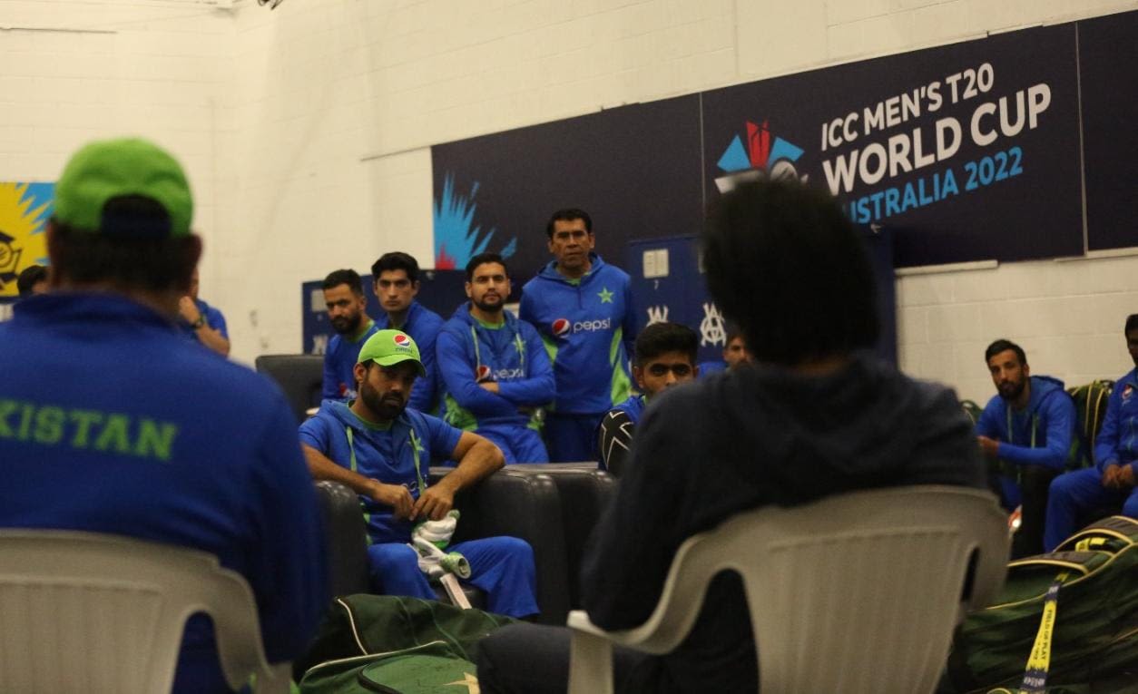The Pakistan players are all attention as Ramiz Raja speaks to them ...