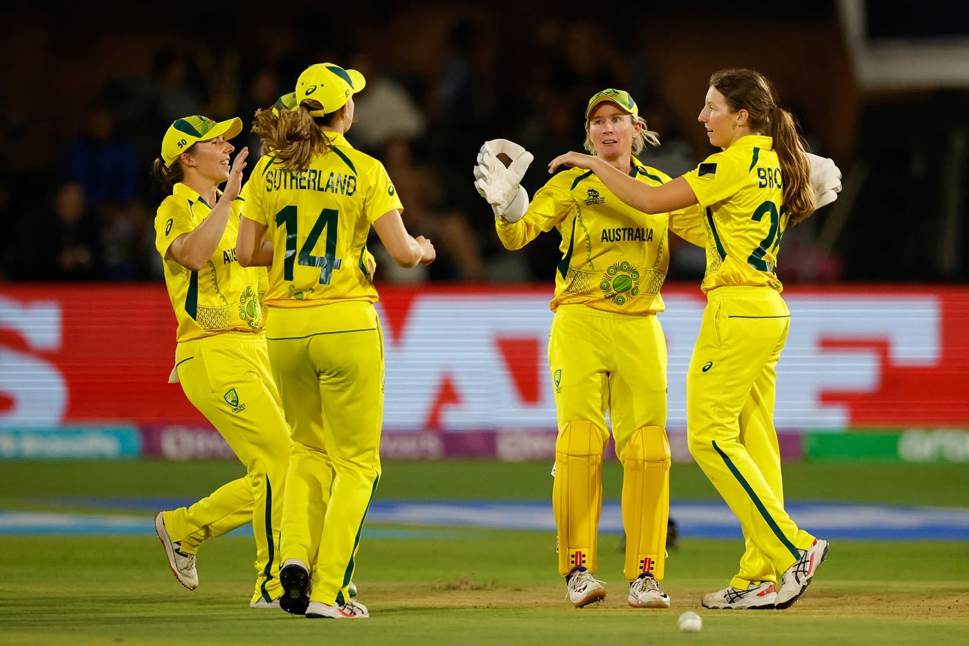 Darcie Brown celebrates with team-mates the dismissal of Marizanne Kapp ...