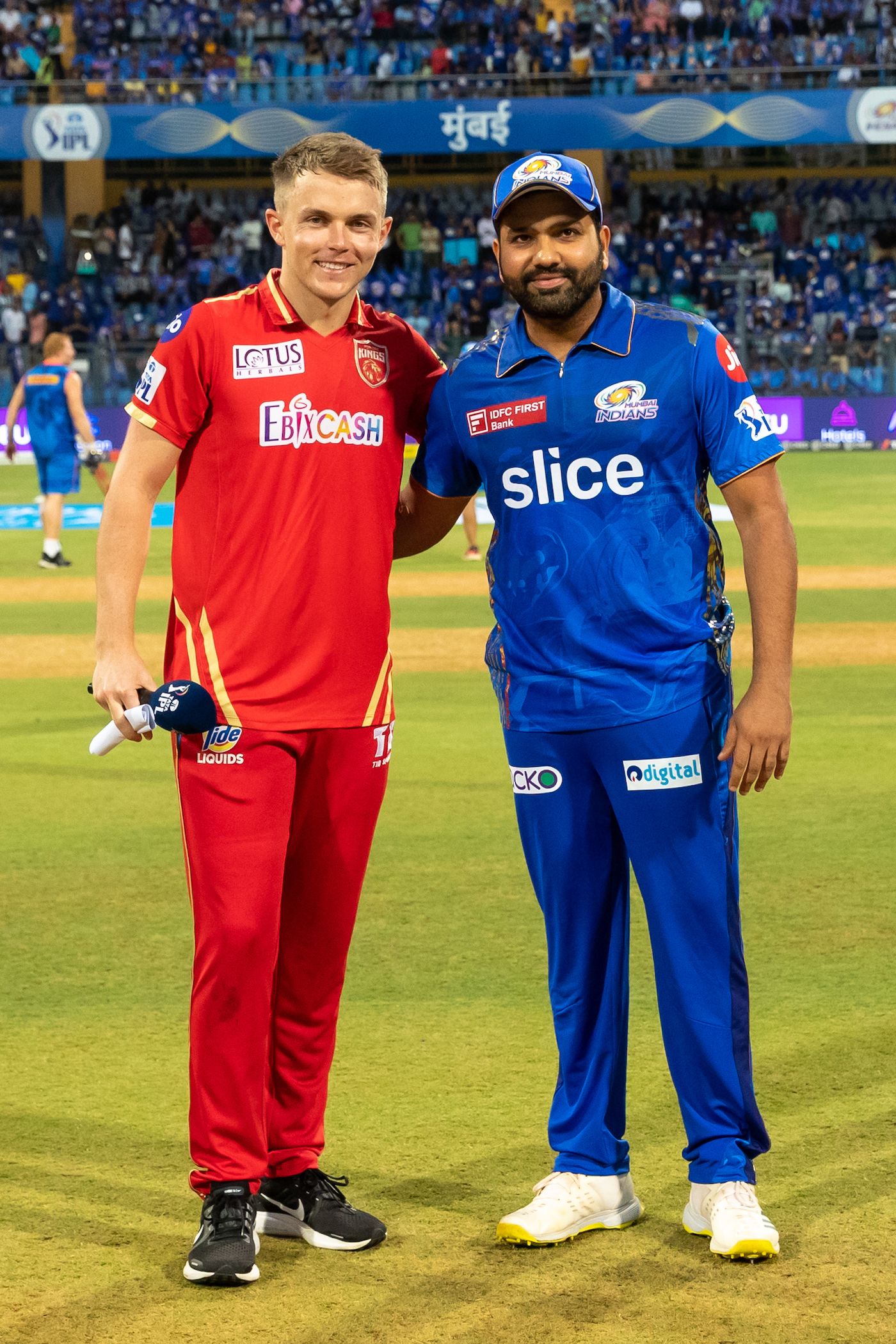 Sam Curran and Rohit Sharma pose after the toss, which Mumbai Indians ...