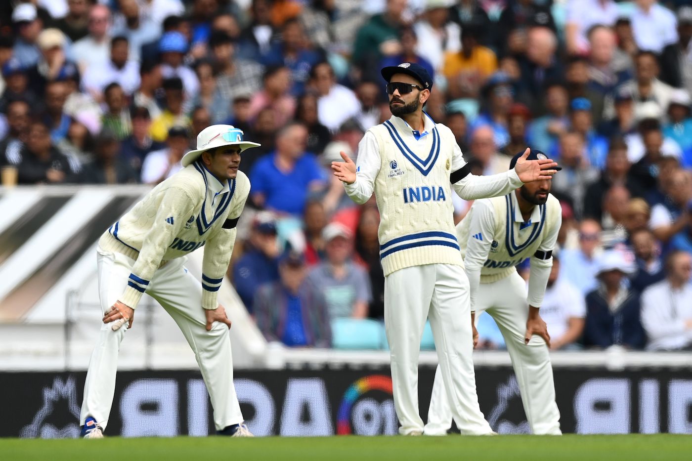 Virat Kohli gestures from the slip cordon