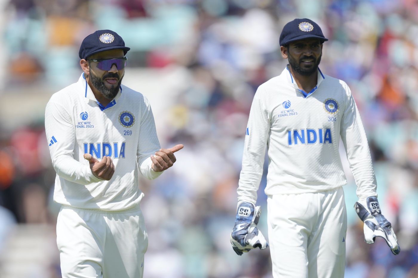 Virat Kohli gestures as KS Bharat looks on | ESPNcricinfo.com