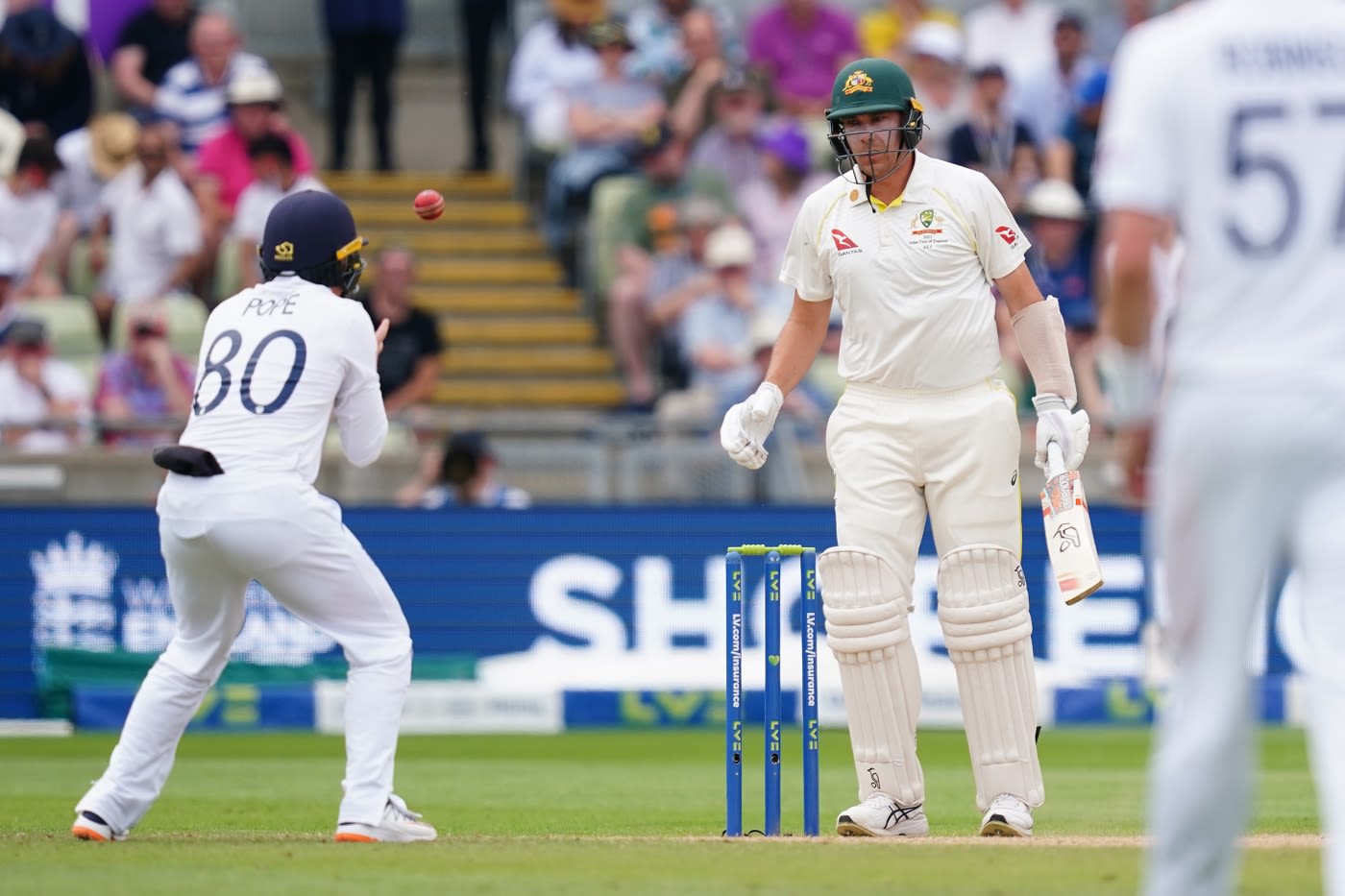 Ollie Pope takes a catch at silly point to end Scott Boland's stay at