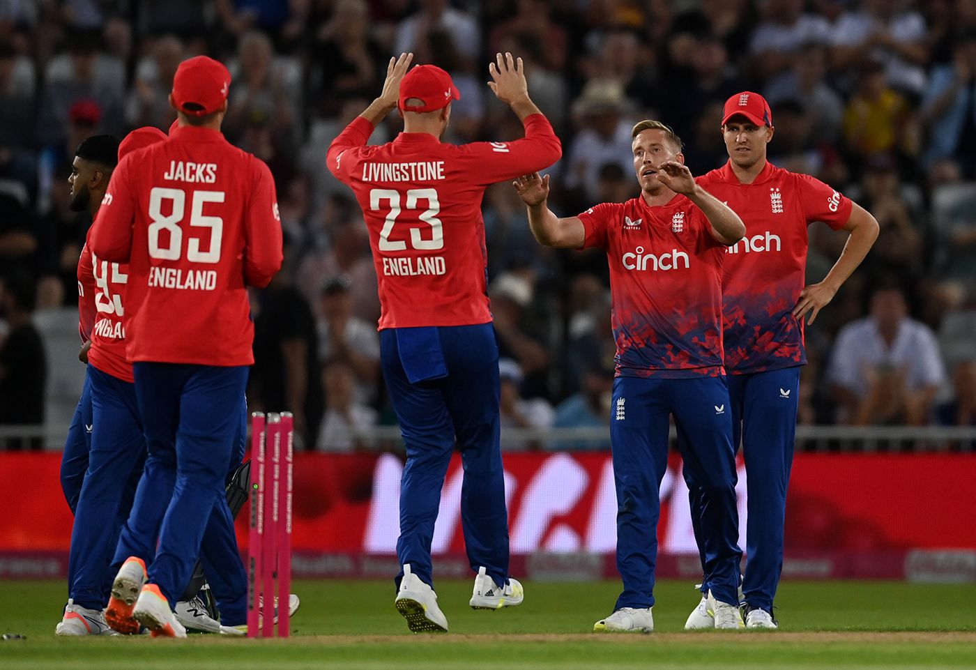 Luke Wood celebrates with team-mates after dismissing Finn Allen ...