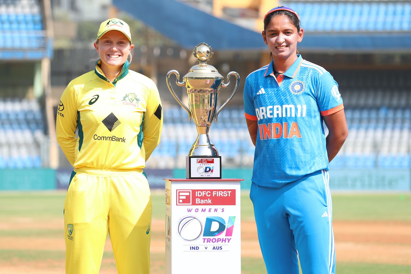 Alyssa Healy and Harmanpreet Kaur pose with the ODI-series trophy ...