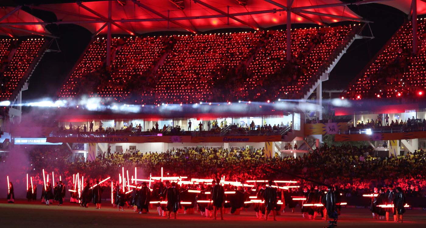 Dancers take to the field during DJ Axwell's set at the opening ...