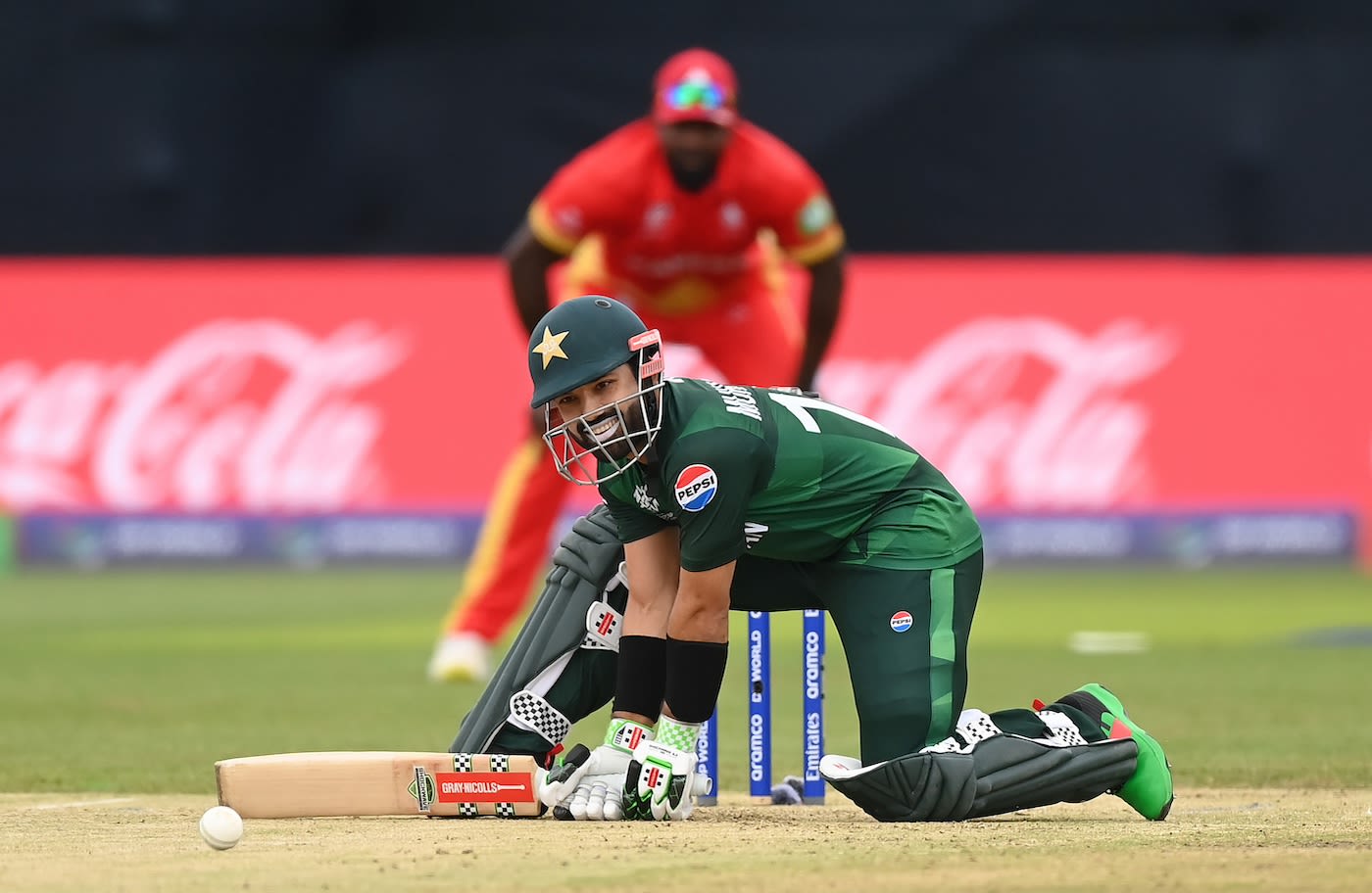 Mohammad Rizwan has a laugh as the ball slips from the bowler's hand ...