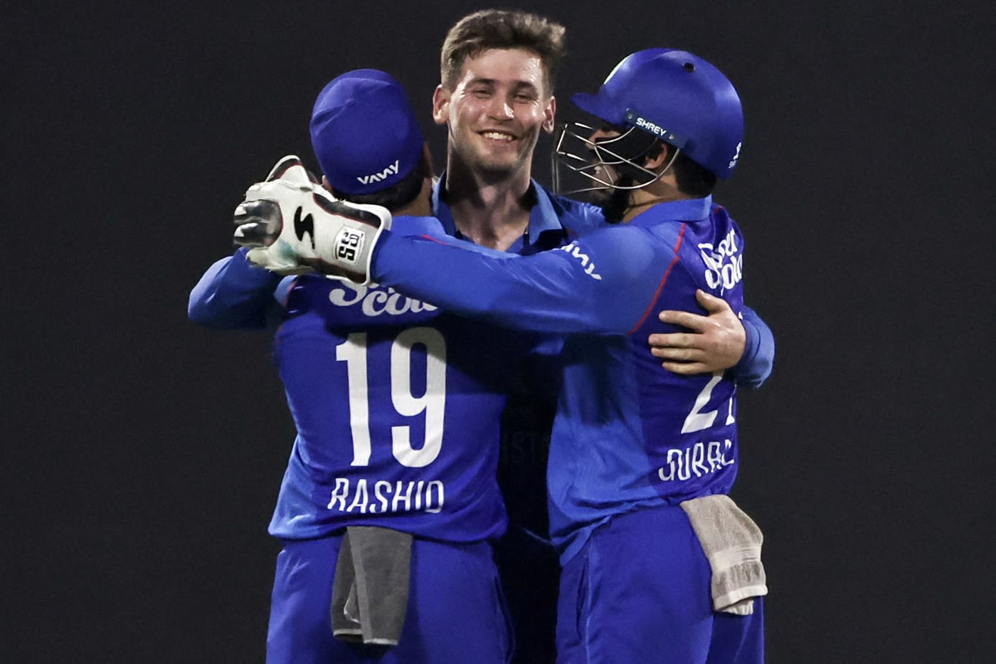 Noor Ahmad celebrates a wicket with Rashid Khan and Rahmanullah Gurbaz ...