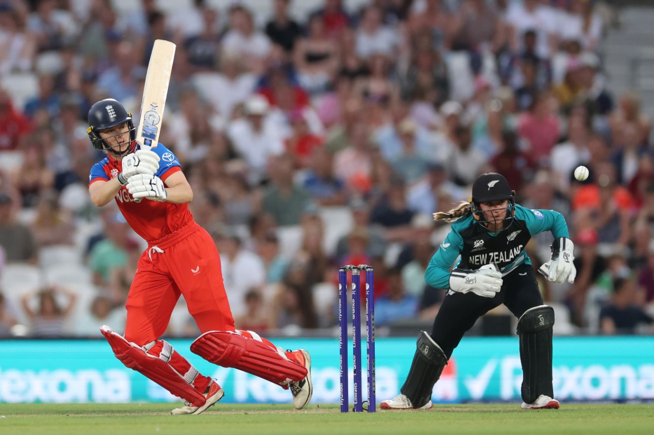 Amy Jones whips a shot off her legs in England's fast start