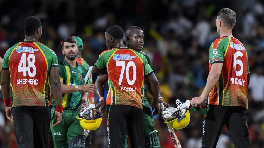Rovman Powell is congratulated by the Amazon Warriors players after the game