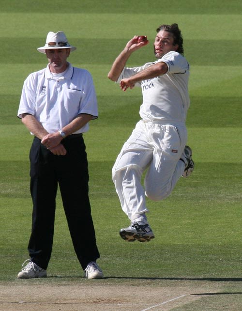 Chris Silverwood, Middlesex's best bowler, steams in