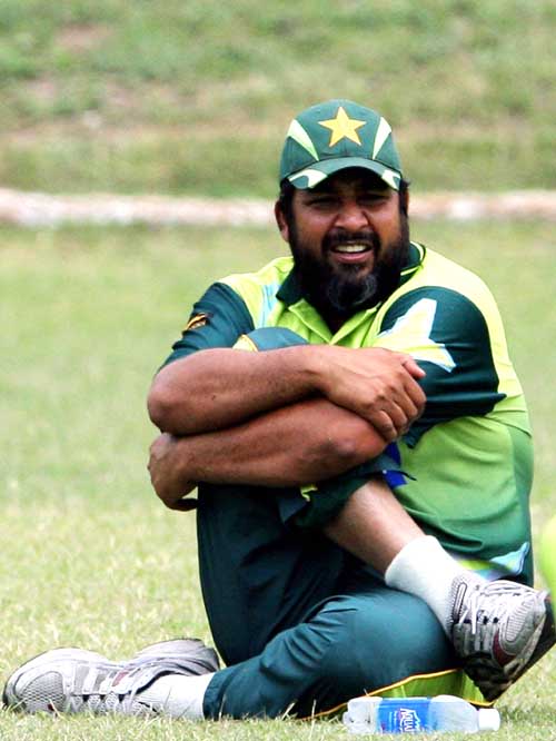 Inzamam-ul-Haq stretches during a practice session in Kingston ...