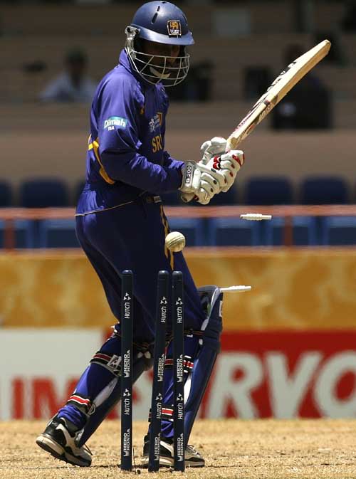 Russell Arnold swings, misses and is cleaned up by Shaun Tait ...