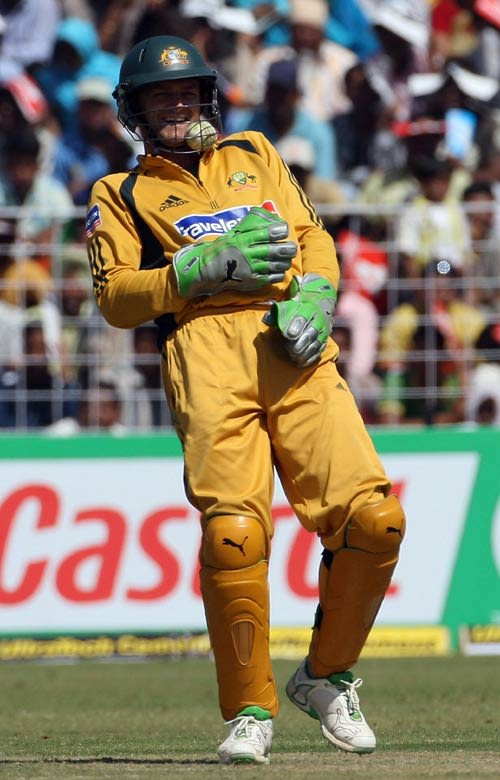 Adam Gilchrist finds an unusual way of collecting the ball