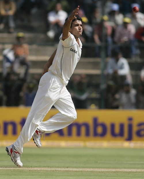 Sourav Ganguly attempts to field the ball off his own bowling