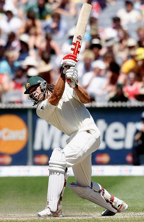 Andrew Symonds hammers a six over longon