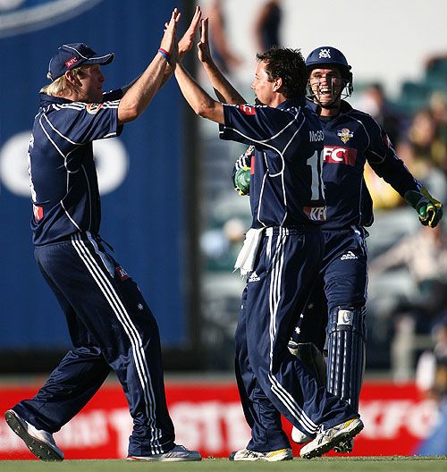 Cameron White and Bryce McGain celebrate a strike