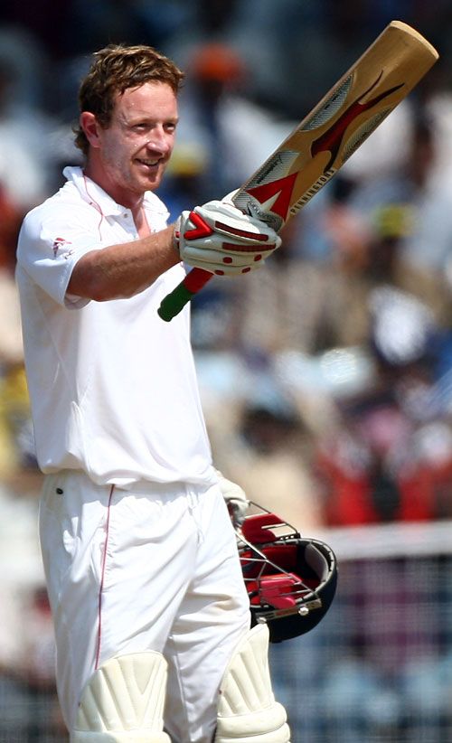 Paul Collingwood raises his bat after reaching his century