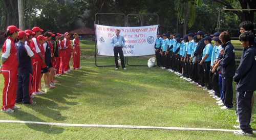 The Hong Kong and Thailand teams line up after their match to hear who