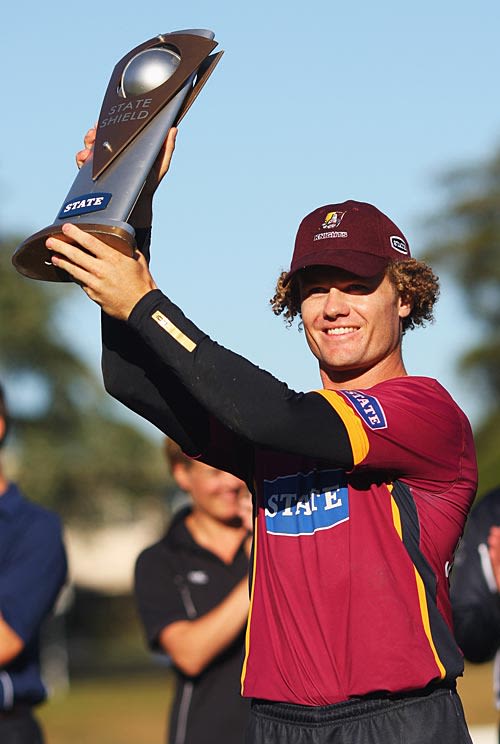 James Marshall lifts the trophy