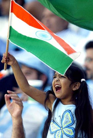 A young Indian fan waves the national flag | ESPNcricinfo.com