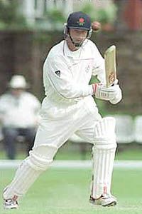 Graham Lloyd watches the course of the ball closely