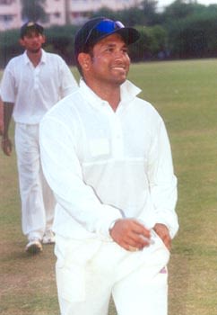 Sachin sports a satisfied look after a good day at the office ...