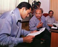 India Cricket Captain Mohammed Azharuddin Goes Through The Team List India Cricket Captain Mohammed Azharuddin Goes Through The Team List