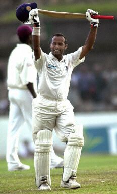 Hashan Tilakaratne acknowledges the crowd after completing his century ...