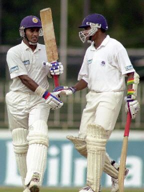 Hashan Tillakaratne celebrates as he completes his half century ...